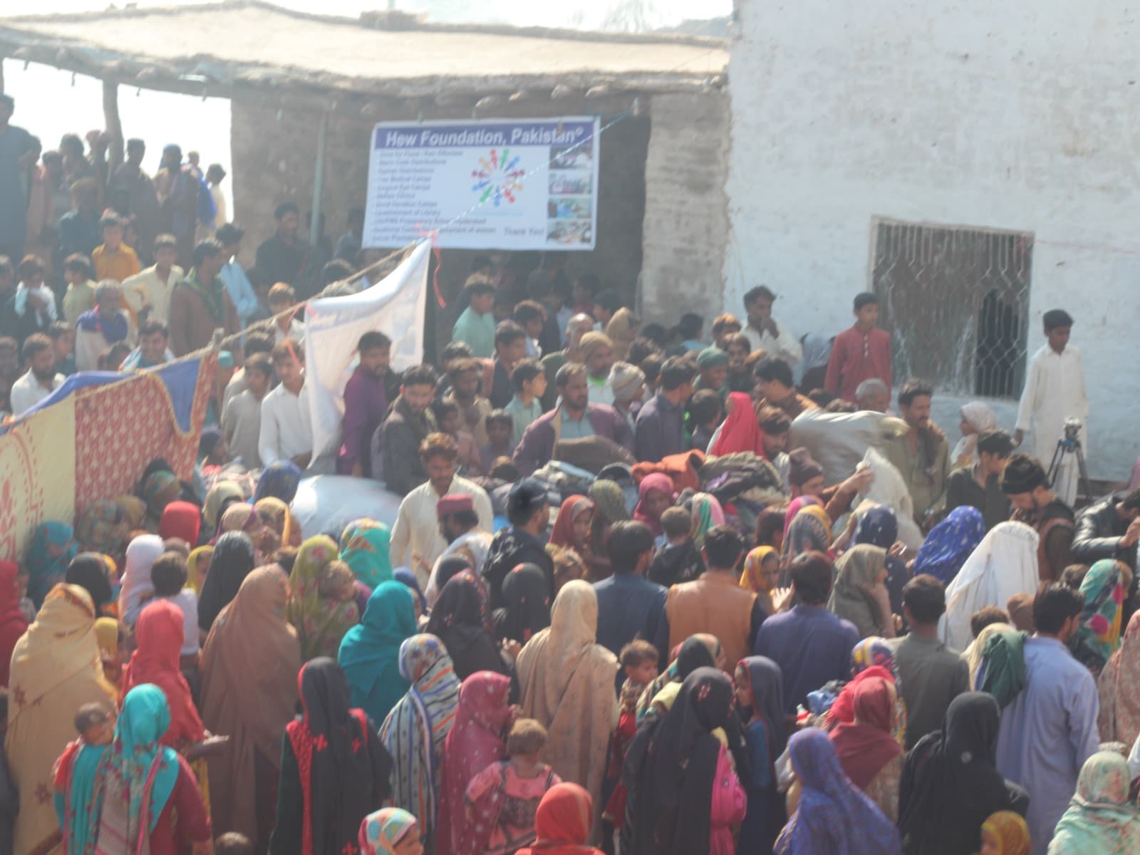 Families gathered during an HEW Foundation community relief response
